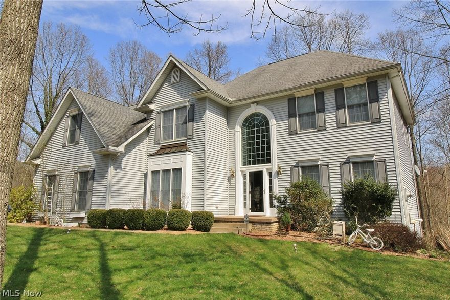 This exquisite home in the Deerwoods Subdivision sits on 5.02 acres of pure scenic beauty with wooded trails for your enjoyment. Over 4300 of total living space! The home features open views of the outdoors, dual staircases to the 2nd floor, a spacious owners suite with whirlpool tub and an open entertainment area that opens to the massive rear deck overlooking the wooded country side. The lower level features a complete 2nd living area with a complete kitchen, living area with fireplace, a full bath, a spacious bedroom and a 2nd laundry/craft room. Bonus feature of additional dishwasher, washer, dryer, range, & refrigerator!