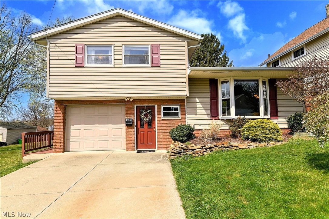 *METICULOUSLY Maintained 4 LEVEL Brick/Vinyl Front Split In Barberton Features 2,000 Square Ft Of Finished Living Space!! *3 Bedrooms, 1.5 Bathrooms, Attached Garage *Finished Basement! *Partial Privacy FENCED IN YARD, Storage Shed + DUAL DECKS Including A Wrap Around That Spans The Entire East Side Of Home -To Enjoy Your Summers Gatherings!! *Walk In To A Large Foyer/Mudroom W/Ceramic Tile Flooring Perfect For Cute Bench Seating & Decor To Welcome & Impress Your Guests Immediately *Guest Half Bathrm *Up A Few Stairs Is An AMAZING Living Rm W/BEAMED 10'8" VAULTED CEILING, Carpet & Bay Picture Window! *Dining Featuring Shiny Hardwood Floors, Black Accent FARMHOUSE Style 5 Light Chandelier To Enjoy Dinners In Fashion & Sliders To The Upper Deck W/Built In Bench Seating *The Kitchen Showcases Ceramic TILE Flooring, FULLY APPLIANCED For A New Homeowner Including Refrigerator, Dishwasher, Above Range Microwave & Oven. Stainless Sink, Faucet W/Sprayer, TILE BACKSPLASH, And Black Accent Light