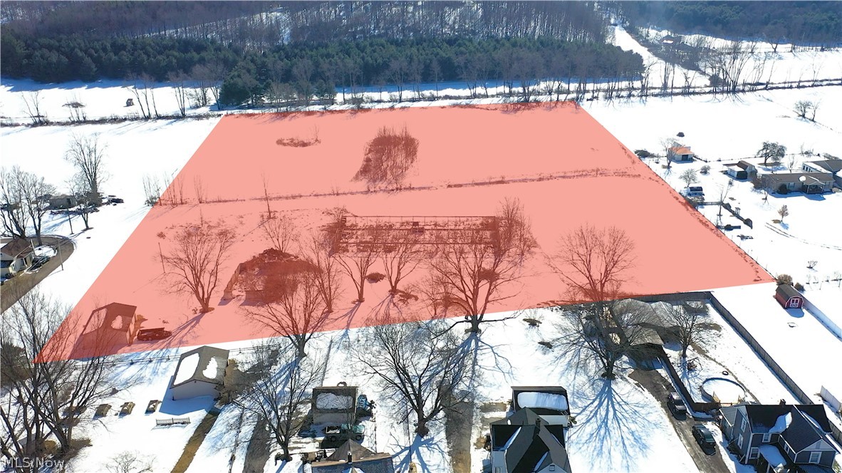 Eight acres frontage on Parks Ave. The property includes a 32x24 pole building. Buyer to conduct due diligence verifying: suitability for intended use, well, septic, utility access, zoning, restrictions, land accessibility from Parks Ave.