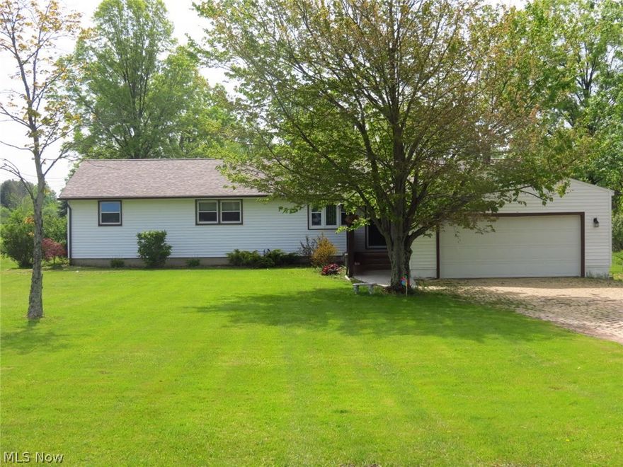 Beautiful Canfield Ranch on over 2 acres! 3 beds 2 and1/2 baths. This home features a beautiful master bedroom and bath, updated main bath, roof and gutters 2016.  Newer appliances, windows, and water softener. This home is move in ready!!