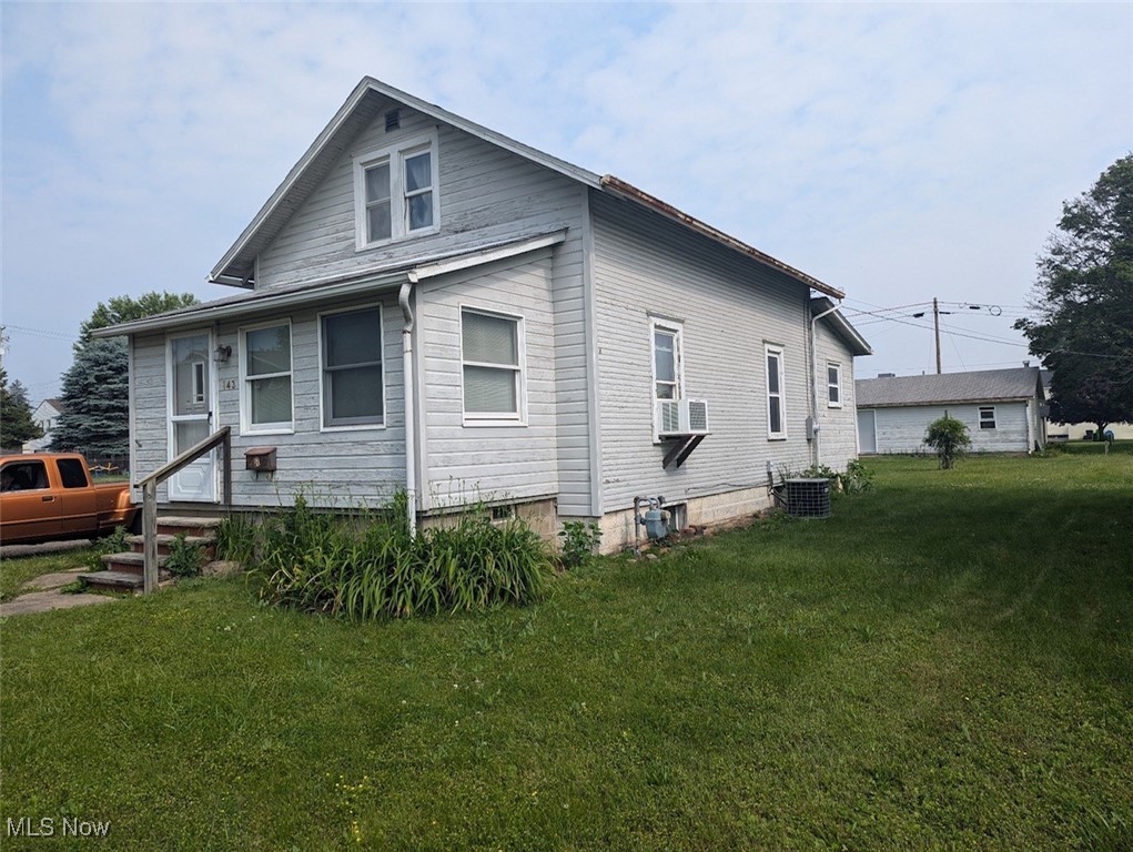 Three bedroom, two bathroom home. On large lot with one car detached garage.