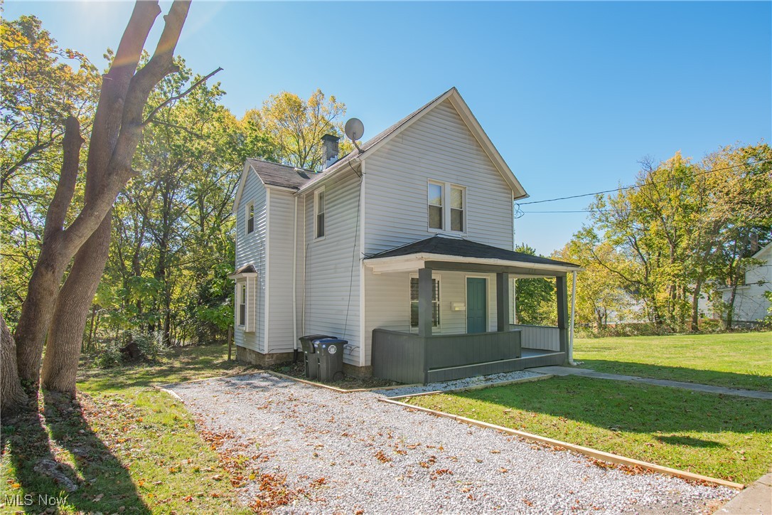 Welcome to this charming 2-bedroom, 1-bath home in Akron, perfectly located close to highways and just minutes from the Akron Zoo! Situated on a spacious, open lot with no neighbors on either side, this property offers privacy and peaceful surroundings. Step onto the inviting front porch and inside to a cozy living room that flows into a formal dining room and an updated kitchen with an eat-in area. Upstairs, you’ll find two comfortable bedrooms and a full bathroom. The basement provides ample storage space for convenience. Enjoy peace of mind with modern updates throughout including a new furnace (2023), hot water tank (2024), windows (2025), and interior upgrades throughout, featuring new paint, flooring, kitchen, and bath in 2025. This is a charming and secluded gem that blends comfort, character, and convenience, schedule your showing today!