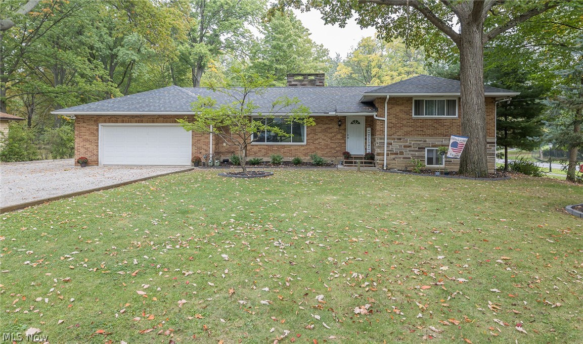 Rare opportunity in the City of Seven Hills! Massive, brick split-level home has two separate living spaces with two separate entrances. Front house: Upon entry you are greeted by a generously sized living room that features new carpeting, has been freshly painted throughout, a fireplace and a dedicated dining room for your convenience. Updated kitchen features plenty of cabinet space, anew countertop and a new backsplash. Over sized master bedroom features refinished original hardwood flooring, his and hers closet and plenty of natural lighting. Main bathroom has been updated with a new granite vanity boasting his and her sinks. Spacious lower level is equipped with a rec room area, two extra bonus rooms and a dedicated laundry area for both homes. Back house: Quaint eat in kitchen sits adjacent to the Livingroom which features a wood burning fireplace, updated full bath and two nice sized bedrooms. Private, fenced in back yard is perfect for entertaining in the warmer months and features an above ground swimming pool, shed and another separate two car garage. Easy access to major highways, shopping and dining puts this home in an ideal location. Hurry up and schedule your very own private showing today because this rare gem won't last long! Back home is currently being utilized as an in-law suite with the potential to be a rental after the home is registered with the city as a legal rental. One year home warranty included!