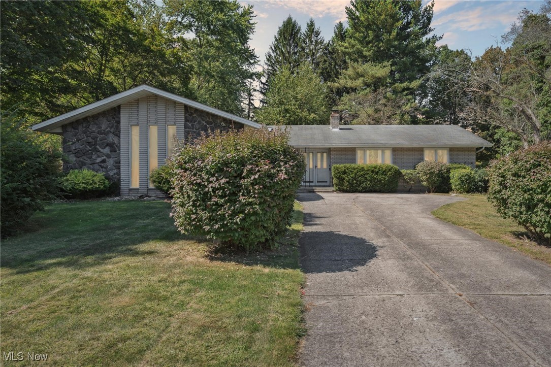 Welcome to 8604 Ottawa Dr, a charming ranch-style home located in the heart of Brecksville, offering the ease of one-floor living in a top-rated school district. Nestled at the end of a quiet dead-end street, this home provides added privacy and a peaceful setting — with no HOA expenses or restrictions to limit your lifestyle. Inside, you'll find a bright, open layout featuring a central kitchen with a large skylight and an island with a breakfast bar, perfect for casual dining or entertaining. The kitchen flows into a spacious dining area and living room, creating a comfortable and inviting main living space. A separate family room with a beautiful stone fireplace offers a cozy retreat for relaxing evenings. The first floor also includes a convenient laundry room and attached half bath. Three well-sized bedrooms offer flexibility for family or guests, with two sharing a hallway bathroom and the third featuring its own private ensuite. The finished basement adds valuable additional living space, ideal for a recreation room, home office, or gym. With its desirable location, functional layout, and fresh, move-in-ready condition, 8604 Ottawa Dr is a solid home in a fantastic community — ready for you to move in and make it your own.