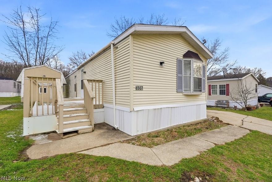 Welcome to this well-maintained and thoughtfully updated modular home offering comfort, space, and functionality with over 1,100 sq ft. Featuring 3 bedrooms and 2 full baths, this home also includes a versatile third room—perfect for a home office, guest space, or additional bedroom. Enjoy the warmer months ahead on the inviting deck, ideal for relaxing or entertaining. Inside, the spacious living room welcomes you with an open layout that flows seamlessly into the eat-in kitchen, highlighted by newer LVP flooring. The remodeled kitchen boasts updated cabinetry, ample counter space, and generous storage, along with a built-in coffee bar or additional seating area for convenience and charm. A dedicated washer and dryer area adds to the home’s practicality. The large owner’s suite offers new carpeting, abundant closet space, and a private bath featuring a double vanity, a soaking tub with skylight, and a separate enclosed toilet area for added privacy. The second bedroom also features new carpeting, while the additional bedroom showcases new LVP flooring and is conveniently located near the second full bath. Additional updates include a roof replacement in 2017 and a storage shed for all your outdoor needs. With many major improvements already completed, this home is ready for its next owner to move in and make it their own!