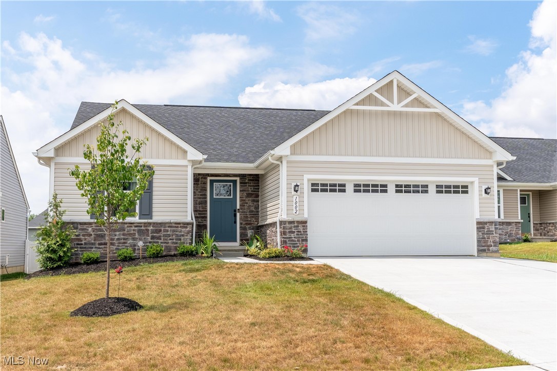 Step into comfort, ease, and modern design at this beautiful 2024-built ranch in Hidden Lakes Village. With 3 bedrooms, 2 full baths, and a thoughtfully designed open-concept layout, this 1,388 sq ft home blends fresh style with everyday function.
From the moment you pull into the wide concrete drive, the curb appeal sets the tone—stone accents, fresh landscaping, and a covered entry welcome you home. Inside, you're greeted by warm-toned luxury vinyl plank flooring and loads of natural light pouring through the spacious living area. The sleek kitchen features brand-new stainless steel appliances, a custom backsplash, quartz countertops, and a large island perfect for morning coffee or evening catch-ups. Just off the kitchen is a cozy dining area with views of the backyard and beyond. The private primary suite is tucked away and offers a walk-in closet and a stunning en-suite bathroom with double vanities and a walk-in tiled shower. Down the hall, you'll find two additional bedrooms, a second full bath with soft neutral finishes, and a convenient main-floor laundry room just steps away from the master bedroom.
Need more room in the future? The full basement is already plumbed for a third bath—ideal for finishing later. Outside, enjoy the friendly atmosphere of Hidden Lakes. The neighborhood offers a community dog park and a pavilion. With close access to Springfield Bog Metro Park and Springfield Lake, nature lovers can appreciate scenic trails, wildflowers, fishing and more. Just minutes from highway access, shopping, and dining, this home offers a peaceful setting without giving up convenience. Don't miss your chance to see this like-new home that checks every box. Schedule your private showing today!