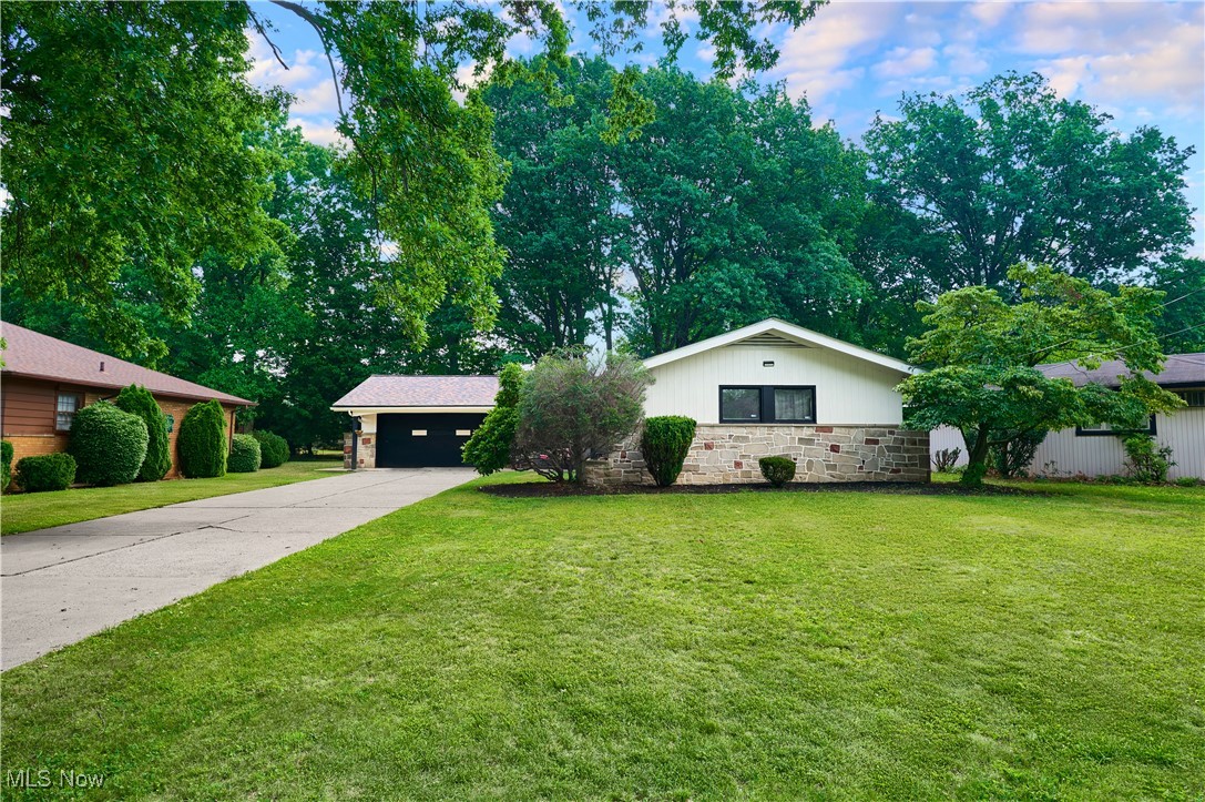 This is a ready-now gem. You won’t need to schedule contractors or worry about breakdowns.
This home is light, bright, and full of charm. The ceiling-height windows in the living area give you a beautiful view of the spacious backyard, making the whole space feel open and connected to nature.
The finished basement with wet bar makes entertaining easy—or gives you the perfect spot for a cozy second living space, playroom, or guest setup. And with the kitchen and bathrooms already updated, you can skip the renovations and focus on enjoying your new space.