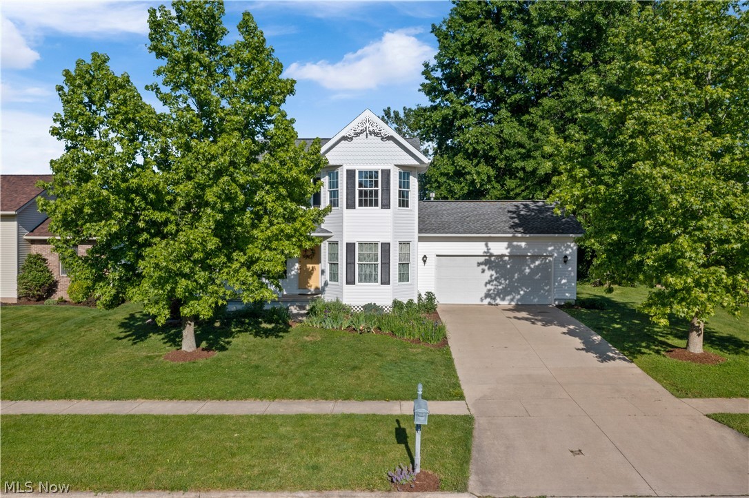 Don't miss out on this beautiful colonial home tucked away on a private cul-de-sac. The cozy front porch is the perfect place to enjoy your morning coffee. Inside is the main living area, sitting room, updated kitchen with new stainless appliances, farmhouse stainless sink, countertops and tile backsplash. There is a large mudroom area and first floor laundry as you come in from the 2-car attached garage and a light and bright dining room as well as a first floor bedroom or office down the hall and a full bath. Upstairs you'll find the large master en-suite with its own 11 x 12 sitting area, two more bedrooms and a third full bath. The unfinished basement has plenty of space for storage and a future rec room. Additional updates include fresh paint throughout, April Air Humidifier installed on furnace in 2019 with ultraviolet light in duct work and roof 2014. The private backyard is perfect for gardening, playing and relaxing!