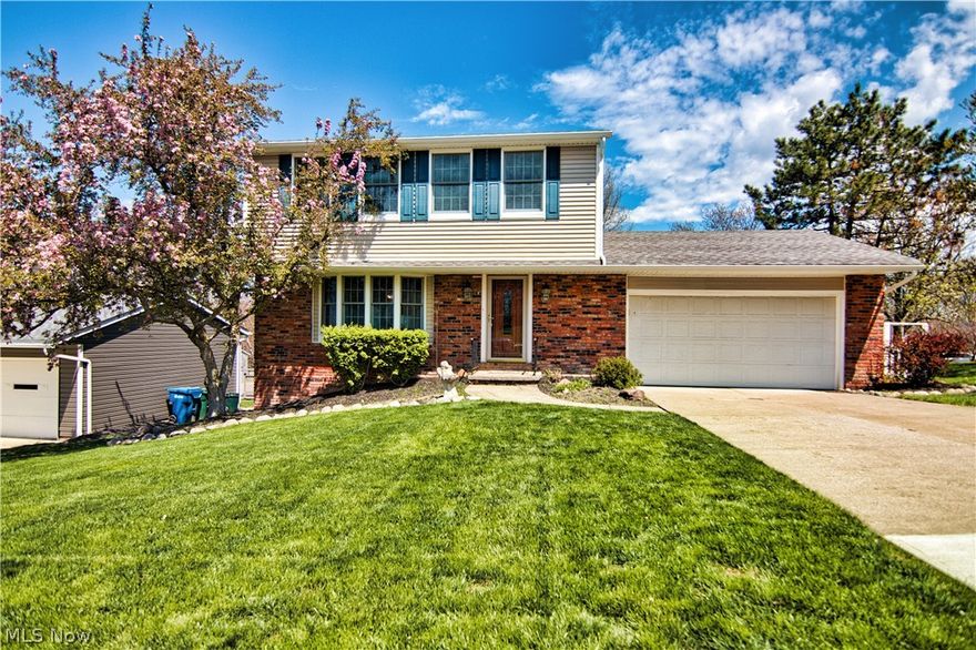 Pride of Ownership shows in this nicely maintained 3 bedroom 1-1/2 bath Colonial. As you walk in the front door you will be greeted by a large living room, foyer with a double closet and Anderson Bay Window. Open concept floor plan flows from living room, kitchen through to the family room. Granite countertops, new flooring and LED lighting, travertine stone with glass backsplash accents included in desk area as well. Stainless Steel appliances (all stay) completing the bright kitchen. Half bath off kitchen, features new vanity/sink, flooring and travertine stone and glass time walls highlight this room. The vaulted ceiling in the family room with fireplace, new flooring, modern cable rail keeps the open concept theme. Newer Pella slider and double hung, triple pane windows with built in blinds provide comfort and privacy. Continuing outside to your Backyard Oasis, Top Deck features a custom made fixed frame Ohio Awning providing an additional outdoor living space. Stairs will lead you down to second level Deck with heated 12 X 24 oval pool surrounded by 5ft privacy/security fence. The landscaping features a decorative fenced vegetable garden with raised beds. Brand new basement makeover with new flooring, LED lighting and baseboard comfort heating. this home is 1 of 2 in Vienna Woods development that features an extended basement under the family room providing 12 X 21 Bonus sq. feet. A 7 x 21 ft. storage area with built-in shelving is great for organization.