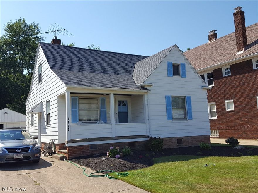 Nice bungalow with huge family room on back with woodburning fireplace walks out to large wooden deck.  Two bedrooms and living room on first with hardwood flooring.  Large bedroom on second with wood flooring and alcove.  Full basement, two car garage, and nice lot!