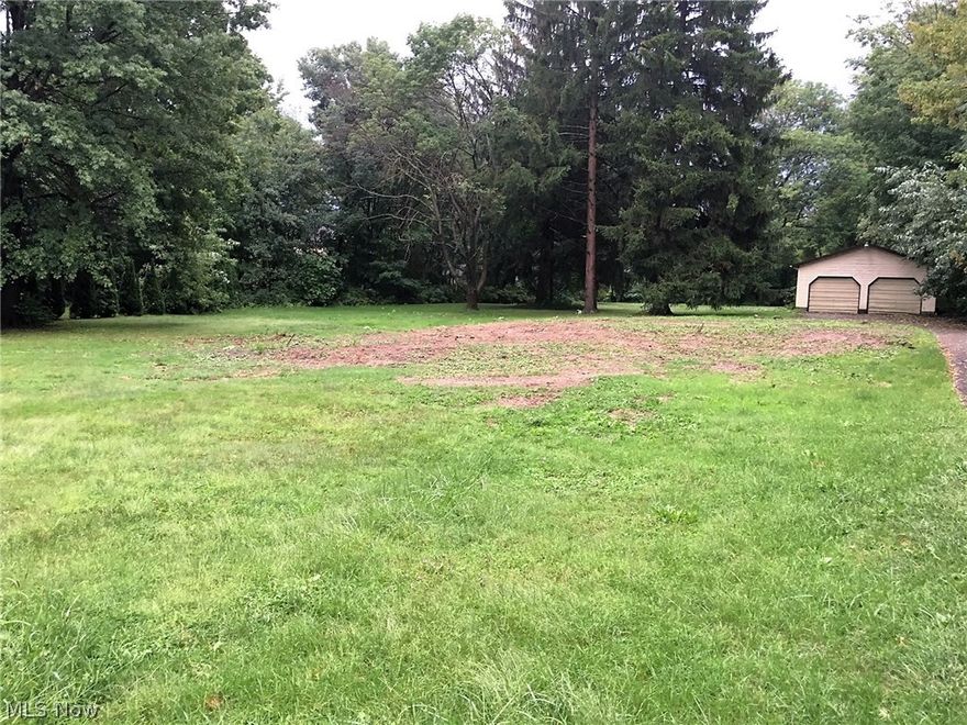 Nice size lot in a very desirable Historic Design Area of the City of Canfield.  This street offers many turn of the century homes that have been restored, coupled with beautiful mature trees, offering delightful shade, beauty and character.  The owner will build to suit--or sell the property as is.  There is a 24 x 24 existing garage in the rear of property that is in decent shape (worth approx. $7,500-$10,000) with a paved driveway from the garage to the street. No tap-in fees required on this parcel, which saves the buyer $2,000!  When the owner demolished the prior structure, he carefully removed everything from below ground level and replaced with clean fill dirt, so no surprises to the would-be builder.