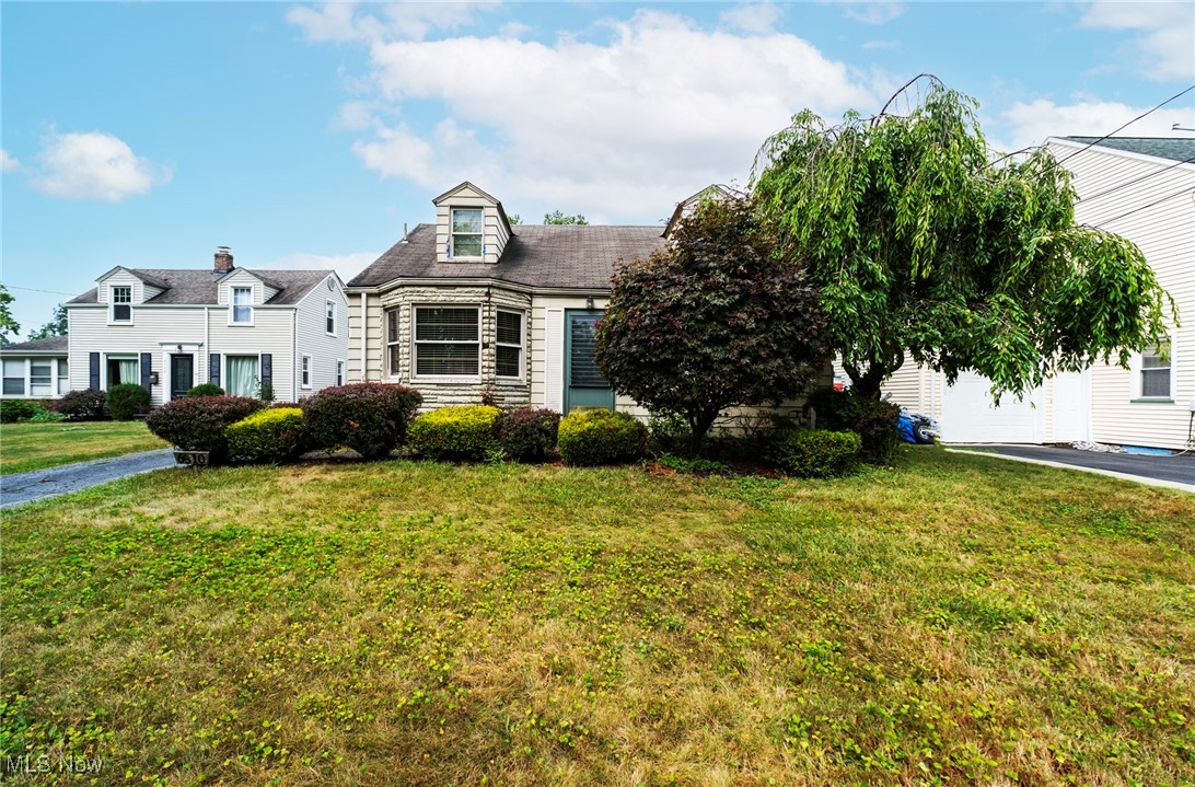 Welcome to 6510 Glendale Avenue! Tucked away from the hustle and bustle, but close to much of the shopping, dining, medical facilities, and green space that Boardman has to offer, you’ll find this 3-bedroom, 1-bathroom Cape Cod with so much potential! Inside, admire the charm of the scalloped fireplace, the arched door frames, and the built-in shelving. Check out the partially finished basement, perfect for hobbies, a home office, or movie nights. Outside, the large, flat, backyard features a playhouse for young explorers and a 1-car detached garage for added convenience. Whether you're looking for an investment property or a primary residence, 6510 Glendale is ready to welcome you!