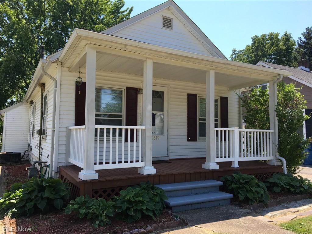 MOVE-IN Ready RANCH—BIGGER THAN IT LOOKS! With an open floor plan, this cozy home feels spacious! ALL NEW FLOORING. Consists of living and dining rooms, eat-in kitchen, two bedrooms with large closets, a full bath, and basement. Front porch for relaxing and watching the world go by. Back deck overlooks a large fence-in yard, which includes a Shed for extra storage. Would make a great starter home, down-sizer, or investment property. Within walking distance to Lakeview Park and Lake Erie; minutes to Black River Landing, Concerts, Festivals, Fireworks. Cheaper than rent and ready for you to move in.