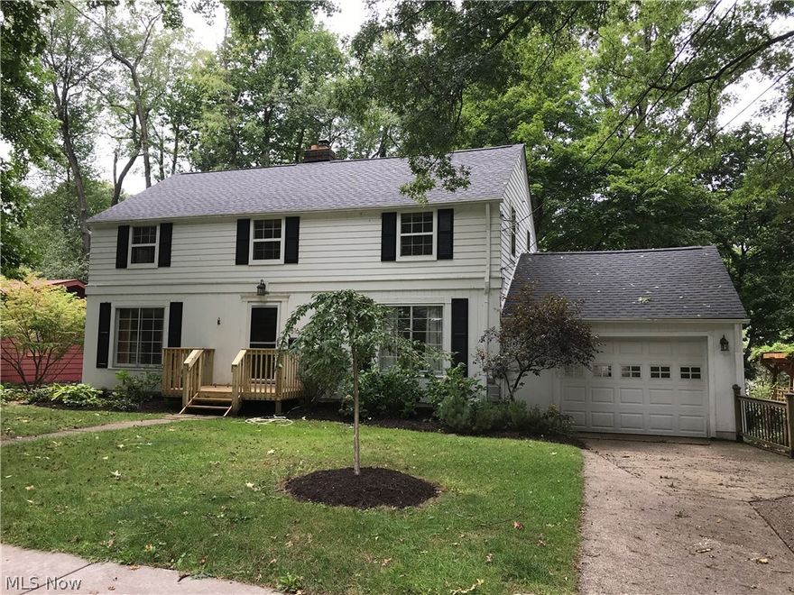 LOCATION, LOCATION, LOCATION ... 516 Edgewood in Kent, Ohio has it! A leisurely walk to the wonderful, revitalized downtown Kent or Kent State University, but very tucked away on a dead end! Also close to Walls Elementary & just a few minutes to Route 76, the Ohio Turnpike, Akron & Cleveland. This Colonial 4/5 Bedroom beauty with Williamsburg feel, is a nature lover's dream! Across the street from 2-acre neighborhood city-owned woods... birds, wildlife and nature abound! Enjoy Original Wood floors in living, dining and 3 of the bedrooms! Entertain guests on your newer expansive Rear Deck made with low-maintenance Composite decking. First floor Bonus Room, tucked away from living room, could easily be used as a Living Suite with dedicated entrance and full bath for the occasional KSU graduate student live-in OR perfect as an in-law living space/guest room. Air-jet tub in upstairs bath. NEW ROOF and front stoop, August 2018. Upgraded baths, Stainless Kitchen Appliances & newer electric p