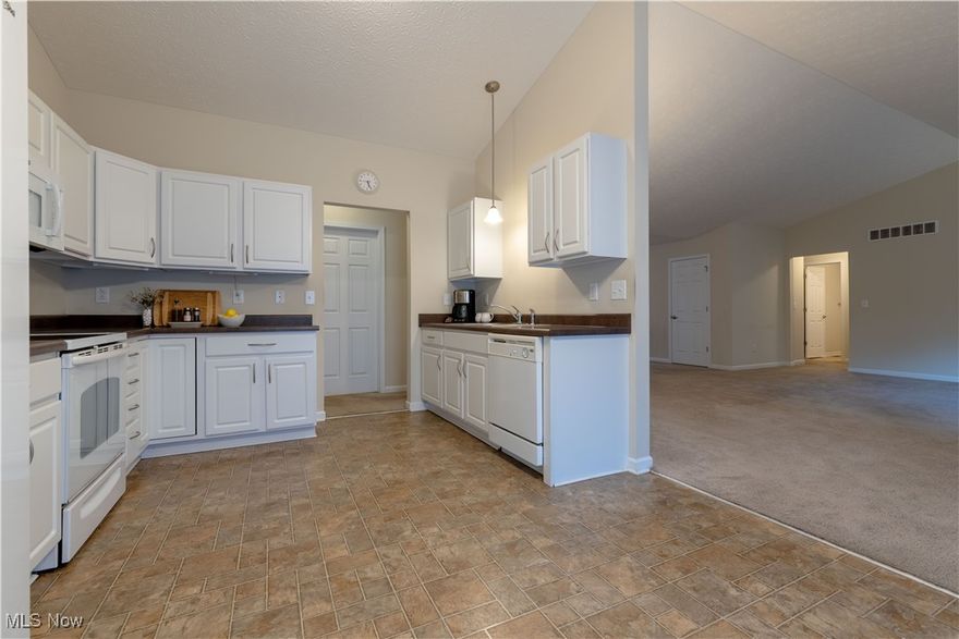 Discover this stunning ranch, built in 2009, with 2,298 sq ft on 6+ acres, just 2.5 miles from beautiful Seneca Lake. Enjoy a spacious living room with cathedral ceilings, an elegant dining room, and an office that can easily convert to a 4th bedroom. The eat-in kitchen features a large pantry and sliding doors to an oversized deck, perfect for outdoors. This home has 3 bedrooms including a master suite with walk-in closet and private bath, plus a second full bath, first-floor laundry, an attached 2-car garage, and full basement with a partially finished half bath and bar area. Additional storage is available in a detached garage (24x32) and metal building (30x40). With 200-amp service, central air, and all appliances, this all-electric home is move-in ready. Don’t miss this gem in the Rolling Hills School District! Mineral rights do not transfer.