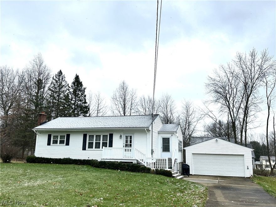 Darling updated ranch in Hubbard Township.  Home is close driving distance to I80 and PA.  This home is move-in ready and has many updates.  As you drive up, you will notice the multi-tiered deck from the front door to the breezeway.  The breezeway is great for summer enjoyment.  As you enter the kitchen you will appreciate the updated cabinets, counter tops and floor.  There is plenty of room for a table.  Entering the cozy living room, you will love the hardwood floors.  The 3 bedroom are all decent size and one has been converted to a 1st floor laundry.  It easily could go back downstairs.  The bathroom was recently remodeled to include a ceramic shower.  The basement was waterproofed within  the last year and provides a 10 year transferrable warranty.  You will also notice the walk-out basement.  Also a 2 car garage built in 1988 is an added plus.  There are updated vinyl tilt-in windows, new electric within 2 years, dimensional shingles, a high efficient furnace and a/c.
