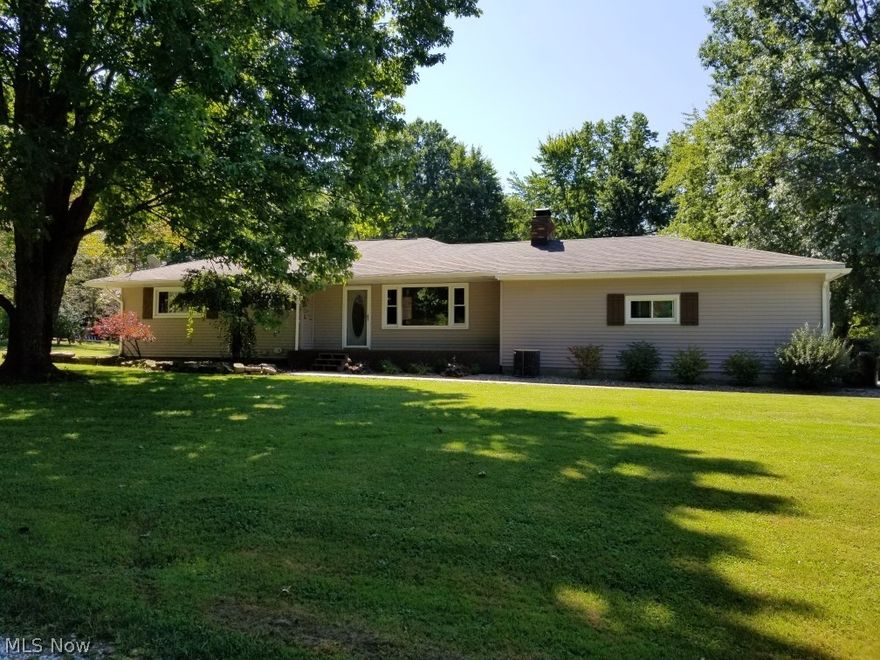 26x26 attached Heated garage plus a 32x40 detached garage. Newer roof, newer vinyl siding. Newer windows, new garage doors with openers, new 200 amp breaker box. New flooring and carpet thruout. New interior doors &  woodwork. New kitchen cabinets with Granite countertops. Reverse osmosis system. New Water treatment system. Plumbing is updated. Underground wire for invisible pet fence. 18 foot pool with new liner and new pump. Sliding glass doors lead to a   2 tier deck from the home [or rear yard ] and to the pool.  NOTE: The basement has a 8 x 8 closet, a laundry room, a storage room, and 2 other unfinished  rooms.SELLER HAS REDUCED PRICE TO $195,000. and will update septic at seller expense if needed by TRUMBULL  COUNTY  HEALTH DEPT.