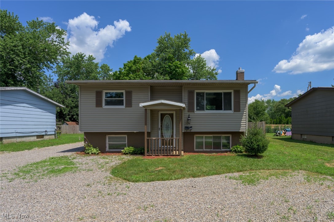 Take a look at this beautiful home in Newcomerstown! The kitchen is updated with all new stainless steel appliances. Hardwood flooring throughout the kitchen, dining area, and living room. The full bath has hardwood flooring and a white / wooden vanity. The bedrooms on the main floor have hardwood flooring and new lighting. The basement is partially finished with a half bath and two extra bedrooms. The large garage is perfect for vehicles, mowers, and has room for a work area or small business. The back yard is fenced in for privacy and is perfect for dog owners. Come and make this your home today!