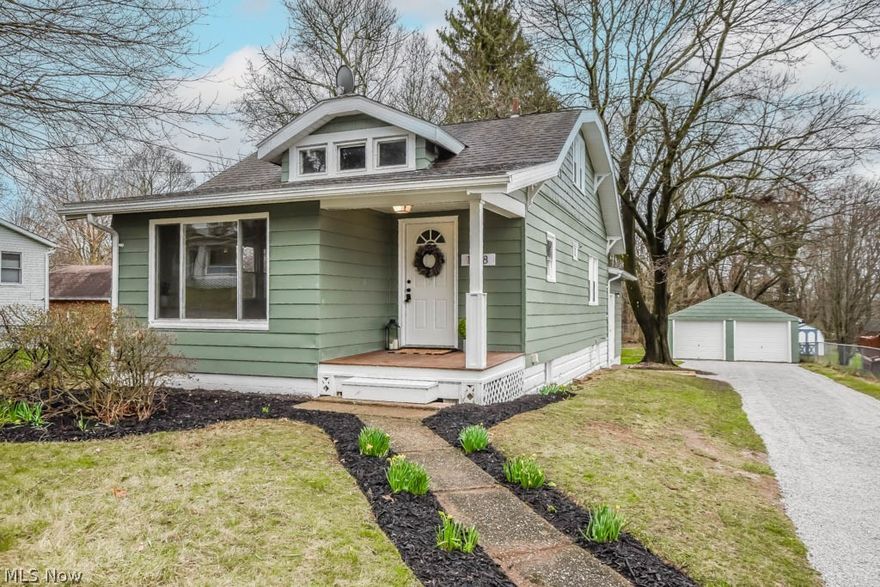 What a charmer! There's so much to love in this nicely updated Ellet Cape from the sun filled living room to the inviting dining room accented by an arched doorway and built-in corner china cabinets.  The kitchen is a dream with wonderful white cabinetry, quartz countertops and stainless steel appliances. Step down to the vaulted family room with beamed ceiling and patio door access to the backyard. There's also a desirable 1st floor master bedroom complete with its own full bath with a gorgeous tiled shower. There are two more newly carpeted bedrooms as well as another remodeled full bath with tub/shower combo. Outside, enjoy the partially fenced backyard with mature trees, a shed and a detached two car garage with new overhead doors. With updates that include a new furnace, A/C, flooring, paint, light fixtures, kitchen, bathrooms, porch and most windows, this home is a must see, call today!