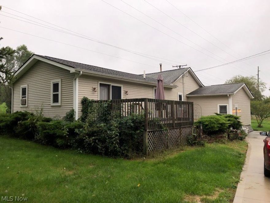 This 1930's Ranch style home features 3 bedrooms, 2 full baths, kitchen and formal dining area, a partial basement, large 22 x 16 Master Bedroom with sliding doors to wood deck and a recently waterproofed basement.  Updates include new vinyl siding, new roof, bathroom vanity, paved driveway, and 2 car detached garage with opener, electric, and wide open 2nd floor for storage or a great place for your mancave.  Whole house backup Generator and a small outdoor shed.   .066 of an acre on a corner lot.