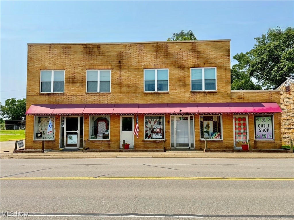 **Prime Investment Opportunity in Belpre, Ohio** Don't miss this potential-packed property offering commercial and residential income streams. Situated in a high-visibility location, this fully rented building features a main level commercial space, and second level residential units. This well-maintained property generates steady rental income, and is perfect for investors seeking a turnkey opportunity in a growing market. An 11 space paved parking lot adds to the appeal and is a valuable asset adding convenience for tenants and customers alike. Whether you're expanding your portfolio or making your first real estate investment, this property offers location, desirability, and immediate return. Belpre is booming, come be a part of it!