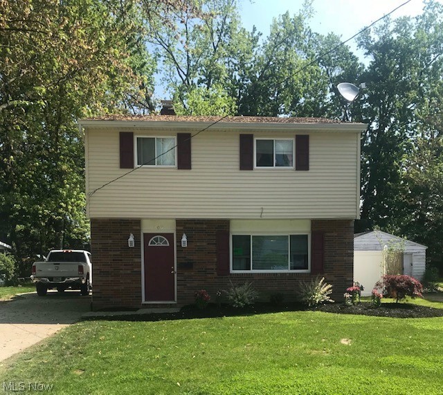 Great Eastlake Colonial ready to go! Large family room with wood burning fireplace. Updated eat in kitchen with ceramic flooring, newer cabinets and all appliances. Nice sized bedrooms. Updated full bathroom with new flooring, tub surround, vanity and fixtures. Newer siding, gutters, exterior doors, stamped concrete patio, electrical, furnace, ac, hot water tank and more. Heated 1 car detached garage. Great location! Seller is motivated!