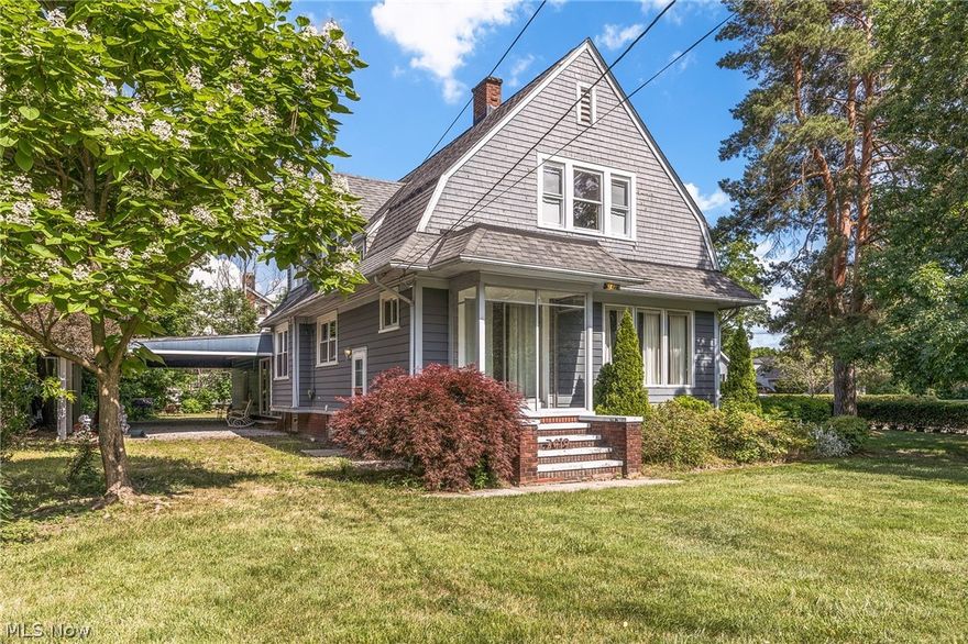 Perfect location and so much green space in front and side yards!  This lovely 1910 4 bedroom colonial boasts over 3400 square feet WITH a finished basement and full bath!  Two car attached garage enters you into the family room with updated flooring and additional sitting area/family room with gas fireplace and living room area with wood burning fireplace and beautiful natural light abounds.  New carpeting and double hardwood flooring (old world well built finishes are apparent), cozy kitchen, updated windows. Back porch area that is waiting for your final touch!  Farmhouse charm with modern amenities.  This house is being sold as is...there is no central air and priced accordingly.