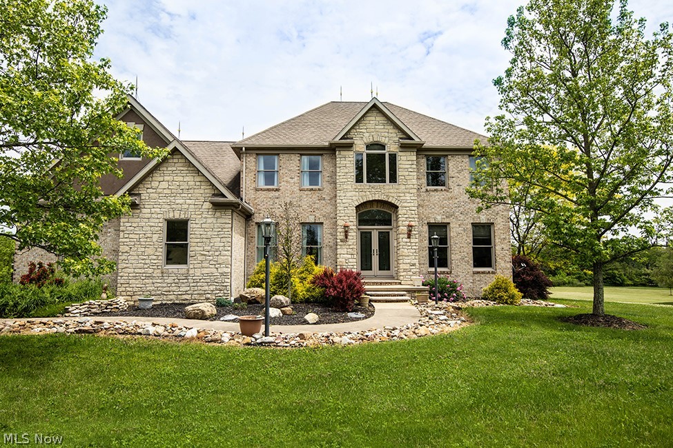 Welcome to this Sharon Township Medina County oasis on 3.5 acres on a quiet cul-de-sac street with FREE gas and royalties. Located in the very desirable Highland school district. This was the builder's personal residence built with high quality throughout. This home greets you with Anderson double doors (art glass) and windows. New flooring throughout and freshly painted, neutral walls. Spacious eat-in kitchen opens to great room with vaulted ceiling and cozy fireplace. Office has cherry wainscoting and double French doors. Enjoy family meals in the large dining room. The first floor also boasts a master suite complete with a European slipper tub and a fully remodeled laundry room with built-in cabinetry. Upstairs there are three additional bedrooms and two full baths and a bonus room that contains a library room with built-in shelves. The basement features 1,400 sq. ft. of finished living space which includes a family room with fireplace, billiards room, theatre room and a wet bar. Wa