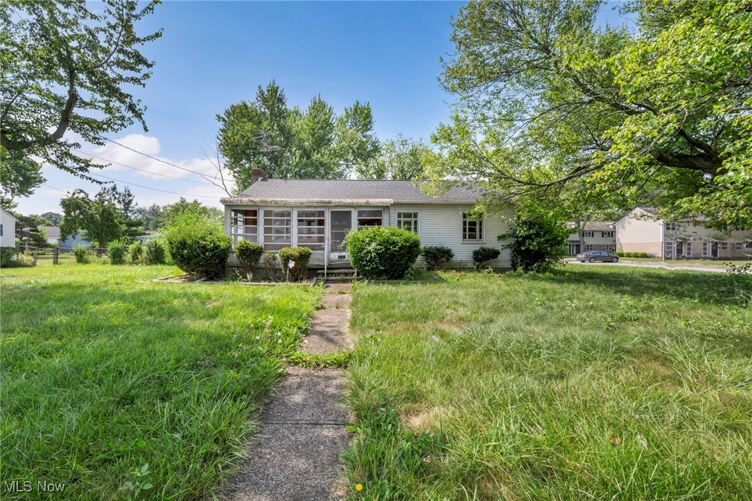 This property in Lorain, Ohio is brimming with opportunity—ideal for someone ready to restore a classic home or capitalize on a strong investment market. The living room features a bold, grand fireplace that serves as a dramatic focal point, inviting transformation and personalization. The sunroom offers a bright canvas for a cozy coffee corner or reading area that overlooks a spacious, flat backyard with serious potential. While the home shows signs of wear and would benefit from updates, many key systems and features have already been refreshed: gutters (5 years ago), the roof (1 month ago), garage door opener and new electric panel (3 years ago), plus updated appliances, flooring, kitchen, bathroom, bedroom fixtures, carpet, and GFCI and grounded outlets—mostly completed in the past 12 months. With these foundational improvements in place, plus the included vacant lot next to the property - it’s easier to envision investing selectively to bring the home back to life. This offering presents a compelling value for a rehabilitated gem or rental opportunity.