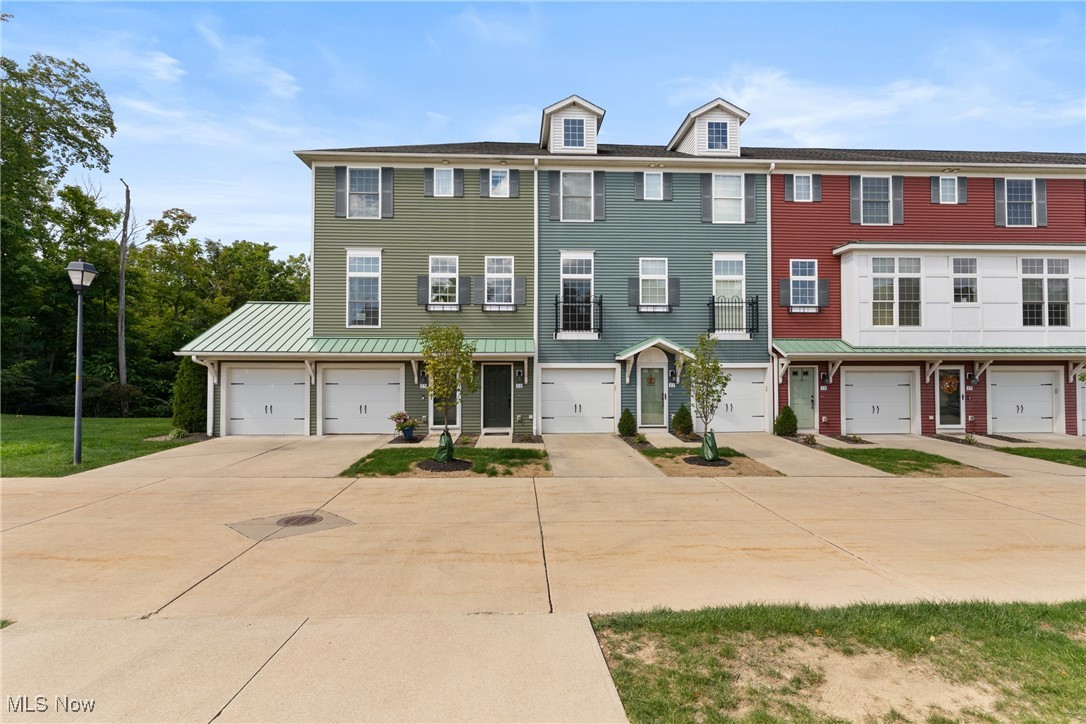 Turn-key townhome living in the heart of Rocky River! This spacious 3 bed, 3.5 bath Grandview townhome offers nearly 1,900 sq ft and one of the best locations within the community, backing to peaceful greenspace and wooded views. Enjoy two newer low-maintenance composite decks—perfect for morning coffee or evening entertaining.
Inside, a smart, open layout features a bright living area with hardwood flowing into the eat-in kitchen with granite countertops, tall cabinetry, stainless appliances, and a walk-in pantry/closet for extra storage. Upstairs, the 3rd floor hosts two vaulted bedrooms with en-suite baths, generous walk-in closets, and convenient laundry with a front-load washer/dryer. The entry level includes the attached garage, mechanicals, a spacious bedroom with its own en-suite, and access to the second deck—ideal for guests, office, or flex space.
Recent updates include neutral carpet (6/2024) and fresh interior paint (6/2024). Gas line present in the living room for a future fireplace if desired (no existing fireplace). A welcoming mudroom at the main entrance adds everyday ease.
All of this in a friendly, engaged community near shopping, dining, recreation, major highways, and award-winning Rocky River schools. Low-maintenance living, prime setting, and move-in ready—schedule your showing today!