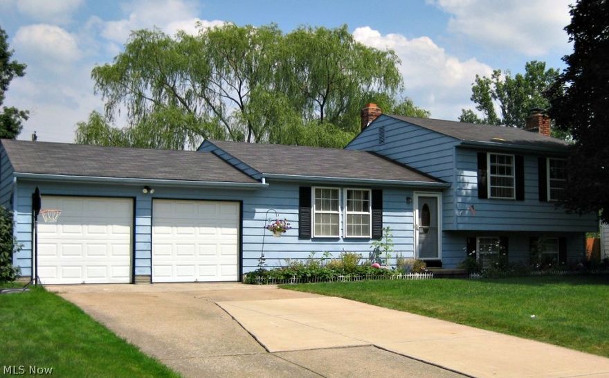 This spectacular 3 bedroom 1.5 bath home is nestled in a quiet neighborhood that includes over 1500 sq ft of living space. Kitchen is centrally located and offers oak cabinetry w/ a sliding door to an expansive deck that overlooks a large backyard, outfitted with a storage shed, perfect for all your extra gardening gear!!  3 cozy bedrooms can be found on the second level, complete with a full bath. Lower level has a generous sized family room w/ wood burning fireplace, half bath and an additional room that can be used as a guest room, workout room or office!   Please call today for a private tour of this darling home!!