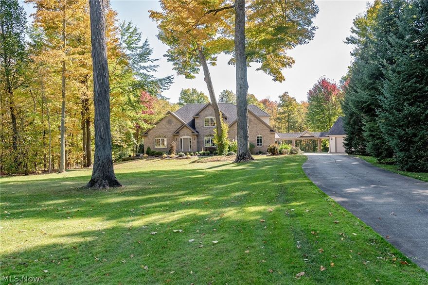 Make every day a vacation in this elegently appointed colonial in Chagrin Falls! This delightful home provides over 3,600 square feet of living space with charming details throughout, plus a fabulous backyard oasis with a pond, a waterfall, a deck, and a patio. It is just waiting for a new owner to appreciate all that is has to offer. An elegant 2 story foyer greets you as you step inside and flows into the impressive great room. The vaulted great room features hardwood floors, a stone fireplace, a wet bar, and a wall of windows that frames the backyard. Walk into the spacious kitchen with an abundance of cabinetry, a breakfast bar, and a sunny eat-in area with deck access. You will absolutely love the first floor master suite, which includes a large bedroom, twin walk-in closets, and an elegantly renovated en-suite bathroom. An office, a formal dining room, a half bathroom, and a convienent laundry room complete the first floor. Upstairs you will find 2 bedrooms and 1 full bath. The w