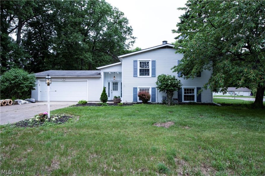 This spacious home is calling your name. This gorgeous updated bi- level home is move-in ready and comes equipped with a fireplace, a two level deck, and a wet bar in the family room! Updates include new carpeting, fresh paint, new flooring in kitchen and front entrance way. Partially fenced in back yard and newly seeded grass.  Just pack your bags & move right in.  This home is priced to sell, so don't miss out.  Schedule your private tour today!