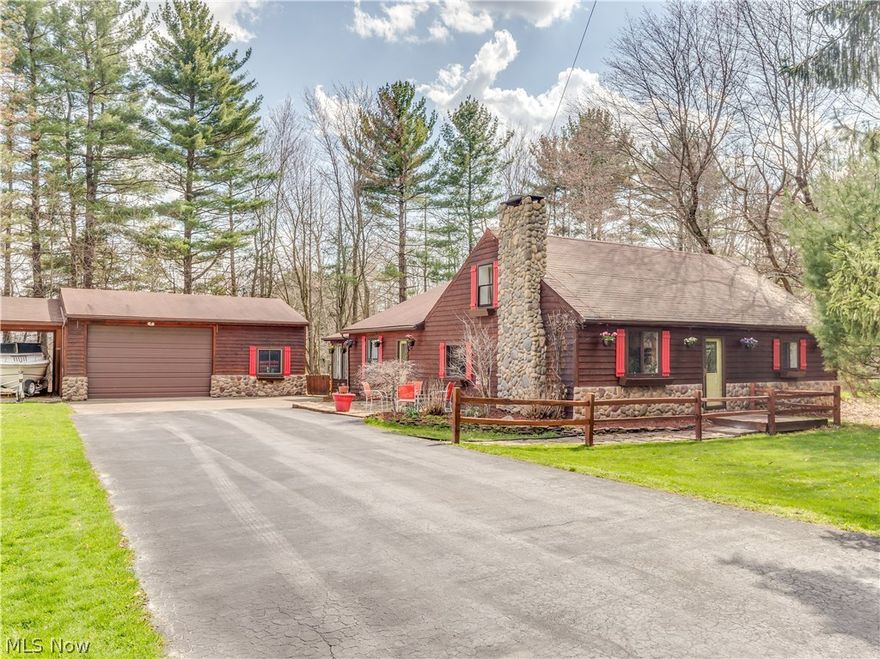 House at the end of the lane...5 homes on this private drive. Log cabin style home on 1.23 acres. 4 bedroom, 2 bath Cape Cod nestled among the trees. Kitchen with eating area, all appliances stay plus a 1st-floor laundry. 30x24 pole barn serves as 2 car garage, extra storage and workshop with 12' garage door. Covered carport perfect for a boat or RV. Nice sunroom, Flag Stone patio, and walk-way. Updates include carpet and fresh paint, updated bath 2018, roof 2002, HVAC 2008, septic and H20 2010. Hot tub stays. One year home warranty.