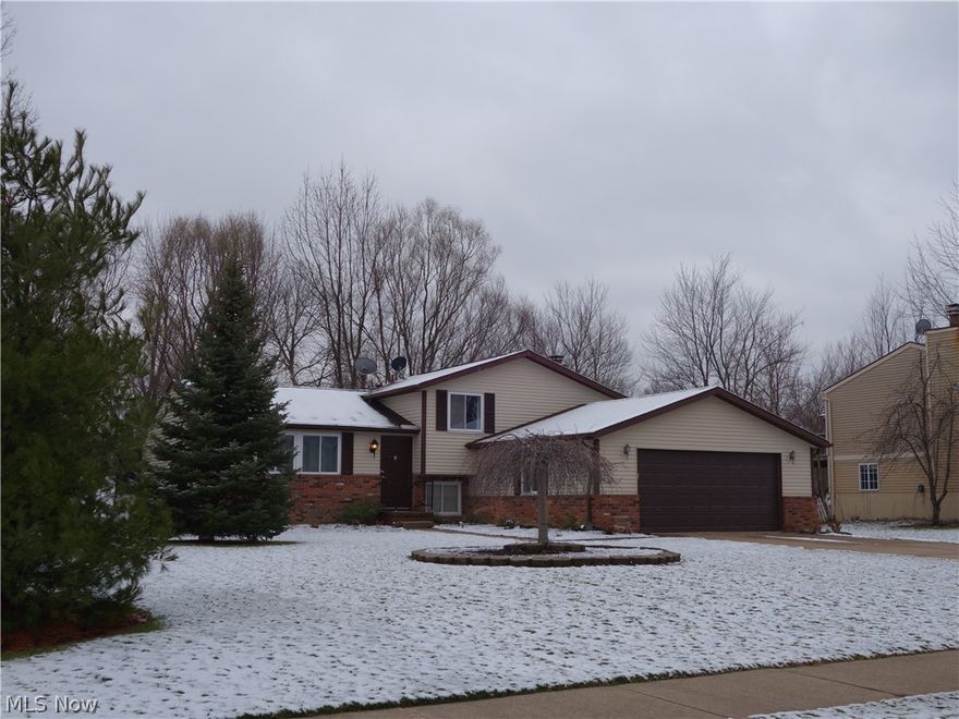 Move in ready! Well maintained, updated 4 level split with an open floor plan! Located in a very convenient Mentor neighborhood of nice homes. This home boasts 3 bedrooms, 2 full baths, and a powder room.  The master has a private bath. The main level is open and inviting with a large dining space, versatile bright living room, and kitchen, including all appliances! The family room level has a game area, wood burning fireplace,  half bath, laundry, and a huge entertainment space to watch the game! Don't miss this extra bonus, a very nice basement area! Great for easy organized storage, or hobbies, or even an additional entertaining space. It doesn't stop there! Off of the kitchen is a great treat! Enjoy the outdoors every day with access to a beautiful 3 season room! Its quite spacious, just begging for visits from friends and family.  You'll truly enjoy this beautiful room, overlooking the park-like private back yard! Come on over and see!