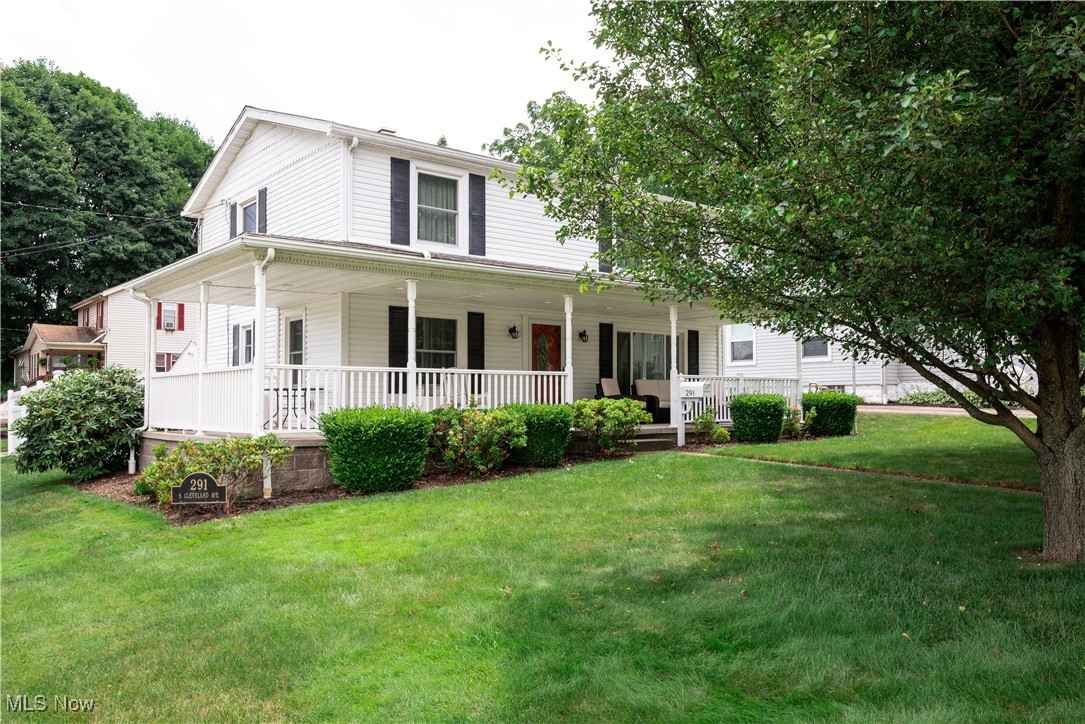 The outstanding curb appeal beckons you to step onto the beautiful wrap-around porch and into a home that’s full of character and comfort. Situated in the heart of the Village of Mogadore, this well-maintained 3-bedroom, 1.5-bath colonial blends timeless style with thoughtful updates—ready for you to move right in.
Inside, you’ll find beautiful wood finishes, a spacious living room and dining room that can flex into a home office or play area. Luxury vinyl plank flooring (2023) in the kitchen and oversized eating area is perfect for everyday meals or entertaining guests. Just off the kitchen is sun filled three-season sunroom(2007 and still looks brand new), complete with walls of windows and offers a refreshing retreat to enjoy morning coffee or evening sunsets all year long.
Upstairs, the large primary bedroom features a walk-in closet, and the full bath has been updated with a modern tub and shower combo. Two additional bedrooms offer private space for guests, kids, crafts or hobbies. The backyard features a newer poured patio (2023) and is protected by a privacy fence offering complete outdoor relaxation. The well-groomed lawn and landscaping, concrete drive and storage shed, make this property easy to-care-for all 4 seasons. Additional highlights of this home include: New windows (2023), All appliances are included —refrigerator, range (new in April 2025) and dishwasher. The finished rec room in the basement extends your living area, to enjoy movie and game nights. The custom built-in storage helps to keep everything neat and tidy.
This inviting home has been lovingly cared for and thoughtfully improved. Don’t miss your opportunity to make it yours—schedule your private showing today!