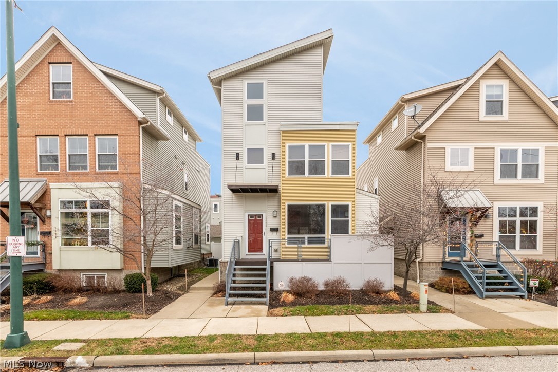 Move in ready and STAND ALONE contemporary Battery Park townhome with basement, roof deck and private yard space - yes please! Enjoy newish the construction in Detroit Shoreway's hottest neighborhood within footsteps of Edgewater Park, popular breweries and restaurants as well as Gordon Square retail! Inside, behold a delightful living space offering 9ft ceilings, hardwood floors, crown moldings, gas fireplace, built in sound system and open concept layout. Chef's kitchen is perfect for entertaining and comes equipped with full set of stainless appliances, granite countertops, large center island, glass tile backsplash and beautiful contrasting dark cabinets. Upstairs find the spacious master suite with ample natural lighting, two custom walk in closets, and bathroom with jacuzzi tub and walk in shower. The bright second bedroom also features a walk in closet and nearby full hall bath. Stunning third level has a bonus room with vaulted ceiling used as a media room with surround sound,