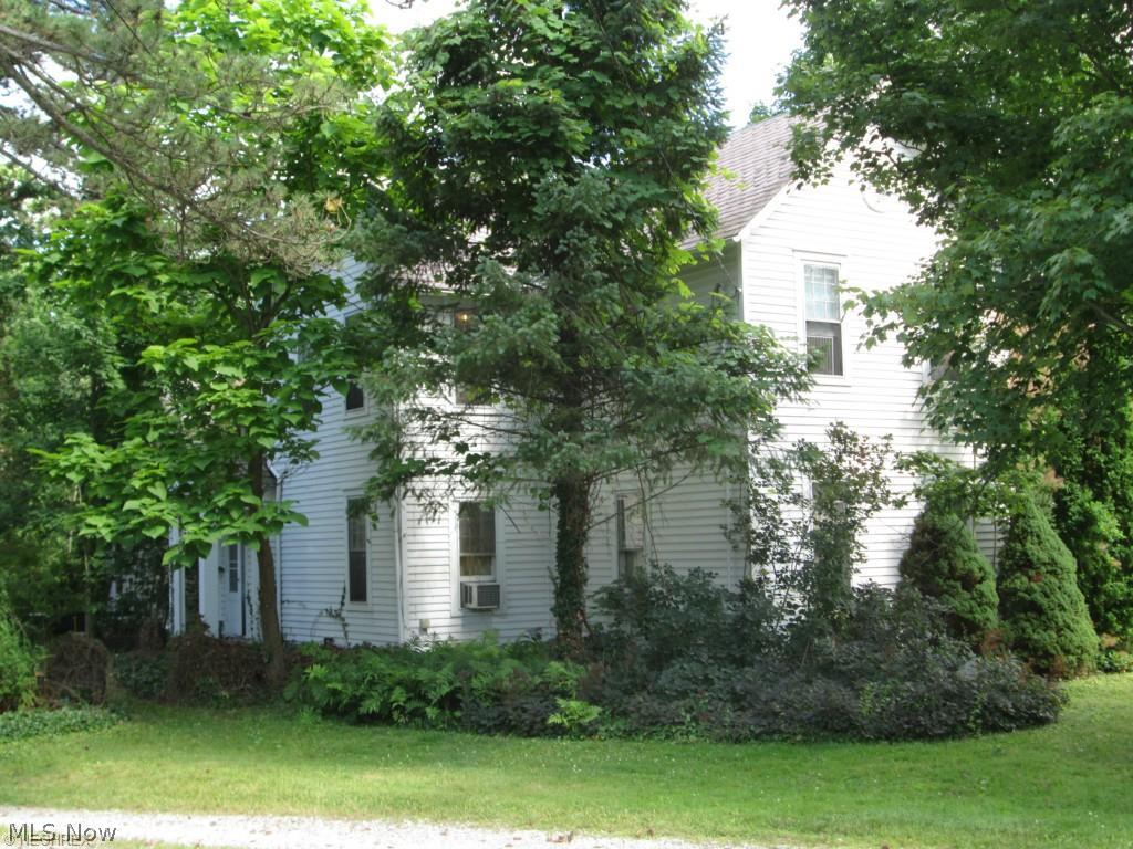 Known as the Riley House. Built in 1865. Located in historic district. Zoning inspector has indicated that this dwelling could be used as a two unit -but would be a non-conforming use. Could be a very gracious home with significant renovation. Basement opens out on ground level at rear of home and provides 2 garage parking spaces. Driveway cannot be blocked as dwelling to rear of this one has an easement to use the drive for ingress and egress. Most buyers would want to redo9 kitchen & baths-put in all new windows-update plumbing-consolidate electrical boxes in basement-& repair/replace sagging plaster through-out the dwelling.