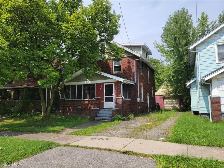 BANK OWNED! Fast sellers' response and open to investors! Two story brick colonial with a detached garage! Formal dining room with built in window seat that is very charming, enclosed porch, full basement and some original woodwork/trim. This home does need some tender loving care so come with your paint and scrub brush! All offers require a minimum earnest money deposit of $1,000.00 or 1% of purchase price, whichever is greater; any offer submitted without the required minimum amount will not be considered.