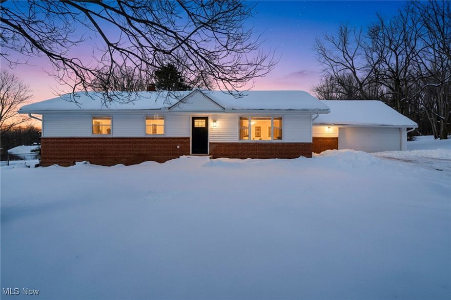 Welcome to 9021 Billings Rd in Kirtland, where space, upgrades, and opportunity come together! Set on a generous parcel of land with a large barn, this property offers the perfect blend of indoor comfort and outdoor versatility. The home features tasteful upgrades throughout, with neutral wall colors and cabinetry that create a clean, fresh backdrop ready for your personal touch while beautifully showcasing the home’s spacious layout. Just off the garage, you’ll find a convenient laundry room complete with abundant storage and a utility sink, plus a nearby flex space ideal for a home office, mudroom, or drop zone, perfect after a day exploring the land or working in the barn. A few steps down, the inviting family room draws your attention with a striking black accent wall and electric fireplace, adding warmth and character while creating an ideal space for entertaining. Sliding doors lead to the expansive backyard, flooding the room with natural light. The front entry opens into an open-concept living area featuring a comfortable living room and a bright white kitchen with a unique L-shaped island and an eat-in dining area. A kitchen cut-out overlooks the family room, making it easy to stay connected while hosting or entertaining. The home offers three bedrooms, including a primary suite with an ensuite bath. A second full bathroom with a tub is conveniently located near the additional bedrooms and main living areas. The unfinished basement is clean and full of potential, offering endless possibilities for future living space, storage, or recreation. Outside, the large barn provides ample room for hobbies, tools, toys, or animals. And the cherry on top, this property is just one neighboring parcel away from the stunning Holden Arboretum, offering a truly special setting close to nature.