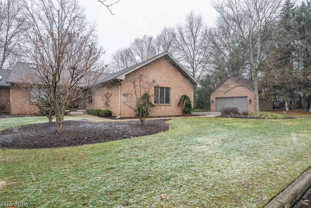 One of a kind custom built, end condo unit in “The Woodlands” of Canfield. Entertain guests on the large multi-level private patio overlooking a beautiful ravine with a flowing stream. An open floor plan offers a massive kitchen with granite counter tops, custom built cabinets, stainless steel appliances, large granite breakfast nook and island. Formal dining area is surrounded by sliding glass doors that offer breath taking views. Enjoy some quiet time in the family room complete with gas fireplace, wood flooring, wet bar and wine rack. Master suite includes walk in closets, vaulted ceiling, his and hers sinks, and walk in shower. Additional bedroom, full bathroom, large office, and laundry also on the main level. The lower level includes a large great room with gas fireplace, wet bar with seating area, workout area, and walk out French doors. Two car attached garage, and tasteful two car detached garage. Brand new in 2019; roof on both condo unit and detached garage, completely new