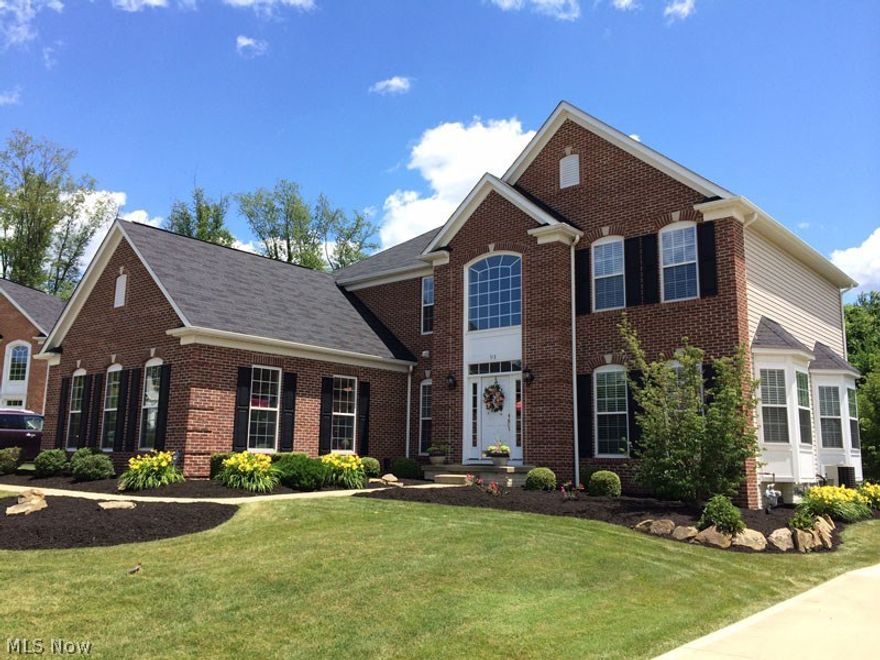 Gorgeous expanded Colonial with upgrades galore! Premium Hillside lot on a Cul-d-sac. Side load 3 car garage with hot & cold water and 2 drains. Professionally landscaped. Huge Trex two level deck with maintenance free Timbertek railings, cascading steps from deck to lavishly manicured back yard. Sunken family room was extended3 feet and features a gorgeous floor to ceiling stone fireplace with Gas Logs. Gourmet kitchen features "added" breakfast room off the deck, gorgeous chocolate glazed maple cabinets, granite countertops, stainless steel sink and all stainless steel appliances will stay. Dramatic turned staircase in 2 story foyer. All bedrooms are spacious and expanded Master Suite features an owner's retreat area for lounge seating. Beautiful on suite master features large garden soaking tub. Custom wooded blinds almost everywhere! Huge laundry room was expanded along with garage. Excellent neighborhood in development. Enjoy Gorgeous Sunset. Convenient to all of west Akron's shop