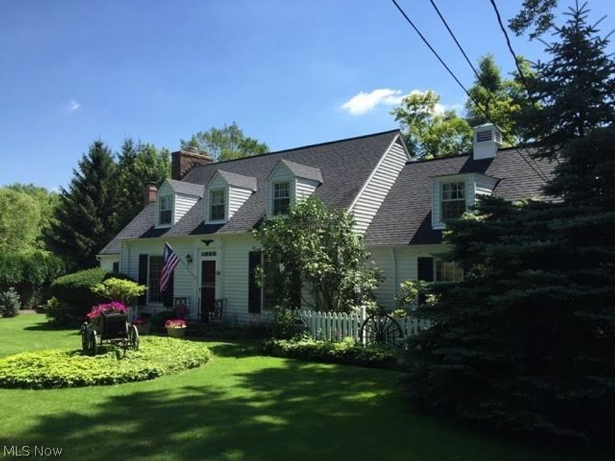 Here is your opportunity to live in one of Pepper Pikes most desirable developments!  This impeccably maintained and updated Cape Cod is situated in a park like setting with an amazing, newly built 2 car garage with loft area, the exterior of which is finished in weather resistant hardy board...extending the home to a 4 car garage. The home  has a lovely flow to the floor plan with 2 large additions giving the home nearly 2400 sq ft of living space.  The updated eat in kitchen boasts of wainscot, hardwood floors and Corian counter tops. The beautiful formal dining room is graced with crown molding, wainscot, built in china cabinets & shelving. The original living room still maintains its 1940s charm with a wood burning fireplace, built in cabinets and a dynamic bay window which looks out onto the wooded rear yard. The great room has vaulted beamed ceilings, a floor to ceiling stone wood burning fireplace and a convenient closeted wet bar. You can commune with nature when spending time