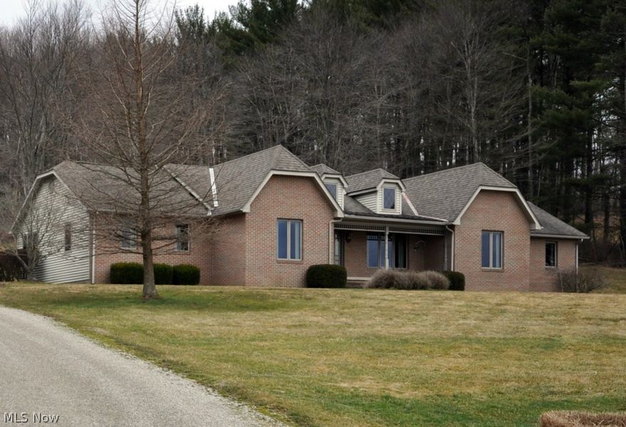 Custom built, one owner ranch home situated on nearly 10 acres in Tri Valley Schools with easy commute to Newark, Zanesville, Columbus or Coshocton.  This unique property offers 3 bedrooms, 2 baths in main home, plus an efficiency  (in-law suit) with a fully appliance Cherry kitchen, living room and full bath and bedroom.  Can be accessed from main home or w exterior entrance.   2 zoned heat and cooling. High quality cherry trim, moldings, door and cabinetry throughout.  Full basement, unfinished at present.  The home is a maintenance free exterior and provides a 2 car garage and separate workshop ideal for a woodworker, artist, hobbyist.  The home is on private drilled well  with Hague conditioner and  Septic system.  Beautiful floor plan, cherry foyer and designer floors. Top of line detail in this country setting home, ideal for gardeners and horse lovers.  A nature like setting, in convenient location.  Beautiful view from all windows.