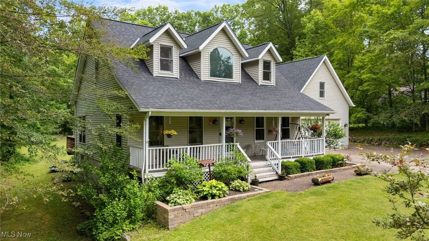 Welcome to your own private retreat! Nestled on 1.6 serene acres, this charming home offers the perfect blend of privacy, comfort, and style. As you approach, the inviting front porch sets the tone for the warmth and character found throughout. Step inside to an open floor plan ideal for both everyday living and entertaining. The kitchen features granite countertops, ample cabinetry, and all appliances are included—move-in ready convenience at its best. The first-floor primary suite boasts newer luxury vinyl flooring, a double-sink vanity, walk-in closet, and a relaxing layout that makes unwinding easy. Upstairs, you'll find two spacious bedrooms, each with generous walk-in closets. Additional highlights include a first-floor laundry room, a finished walk-out basement offering extra living or recreational space, and an outbuilding/shed perfect for storage, or equipment. Some recent updates, roof 2024, LTV Master and Bonus room 2024, whole house humidifier 2023 and water softener 2023.