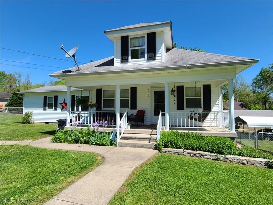 The main house was built in 1920 but an addition was added approximately 15 years ago. Very nice 4 bed, 2 full bath home at end of a dead-end street in a quiet neighborhood. New comfy deck overlooking the large fenced-in back yard and front porch sitting too.  The seller bought the home as a foreclosure and has made many improvements. Owner suite on the main level with walk-in closet and slider door to new deck.  Currently, the 2nd main floor bedroom has a washer and dryer in the closet but there is also a laundry hook up in the walkout basement.  2nd full bath is upstairs flanked by 2 more bedrooms but irregular sizes. The foyer could be used as a bonus living space. No garage but plenty of room to add.