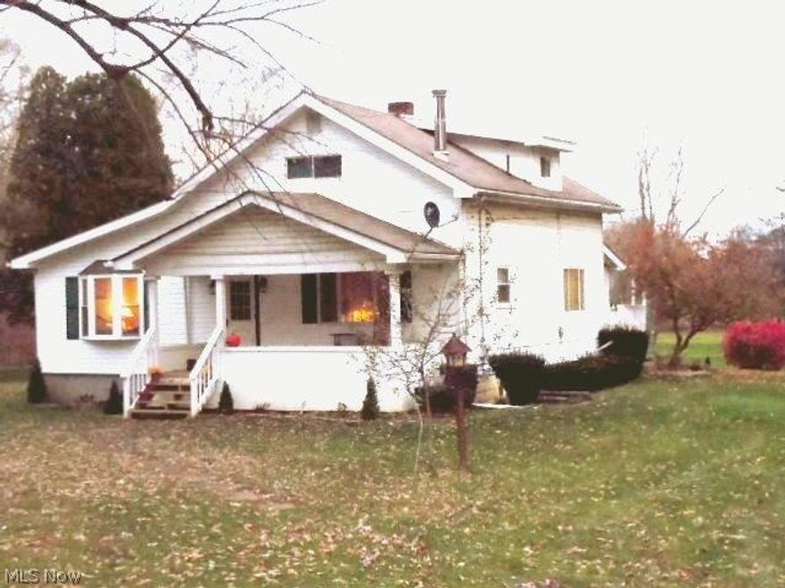 Charming Farm House w/first floor master bedroom & bath w/Jacuzzi tub & Shower, first floor Laundry & 1/2 Bath and Nice size Kit  2nd story has 2 Bedrooms and Full Bath. Nice Front Porch , Great back deck overlooking 3.9 level Acres and Large detached garage for 2 to 4 maybe 6 cars.....Country Living at its Best.....Close to Everything!!!!