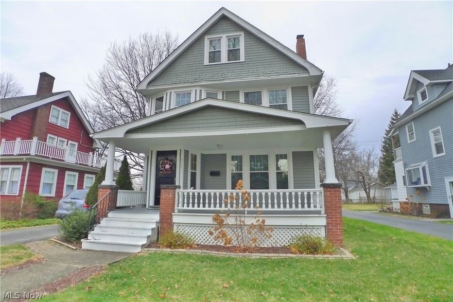 Terrific updated Front Porch Colonial on a peaceful & popular street in the heart of Cleveland Heights. List of updates is extensive & includes newer double pane windows & storms, cement/asphalt turnaround driveway, 3 car garage, central AC, mechanicals, hot water tank, electric panel & partial replacement roof. This charming home offers so much outside living space too including a recently refinished deck at rear & the charming front porch - all on the park-like lot with fenced yard! Inside there’s charm & detail throughout including built-in cabinets in the Dining Room w/leaded glass, a window seat, accent moldings & beautiful hardwood floors throughout. Updated eat-in Kitchen has corian counters & tile backsplash. Second floor has three bedrooms all with newer replacement windows & generous closets & there's a remodeled Full Bathroom w/ ceramic tile & newer Bath Fitter's shower/tub surround. Balcony to rear! 3rd floor is unfinished & offers a huge flex space for storage or could be