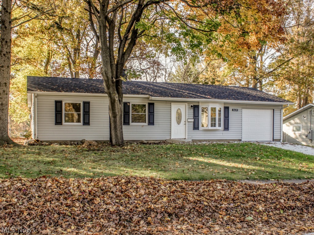 Beautifully updated ranch home in Stow. One floor living at its best. Kitchen has new cabinets, porcelain tile floor, mosaic back splash, and stainless steel appliances. Open kitchen and dining area have access to your patio overlooking the well sized, fully fenced back yard. Large master bedroom has walk-in closet and crown molding. Every room has been freshly painted. New carpet and padding in living room and all bedrooms. Bathroom completely updated including new porcelain tiles, vanity, tub/shower, sink, and cabinets. New roof in 2014. Newer windows and siding. New concrete drive way and walk way. Updated electrical and outlets. Attached garage with new insulated garage door. Move in and enjoy.