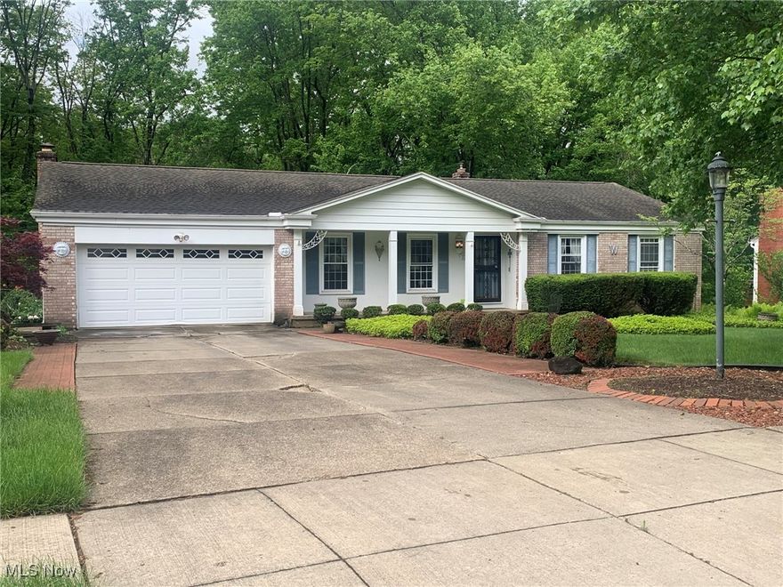 First floor has three bedrooms, two baths, family room w fireplace formal dining & large living room. Great deck overlooks Sand Run Park. Fourth bedroom & half bath for the teenager who wants privacy with private entrance out walk out basement. No wires or telephone poles! beautiful neighborhood. Brand New Air conditioning unit . Basement is huge with tons of storage lots of cabinets lots of shelving. Two car attached garage with attic space